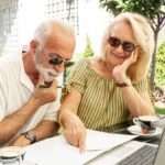 elderly couple taking notes agenda on retirement