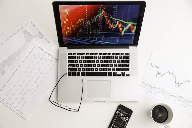 A laptop on the table displaying Stocks market